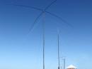Our full-sized, switchable, crossed dipoles for 40m (foreground) along with our 4 element monobanders for 20- and 15 meters made running QRP an entirely new experience!